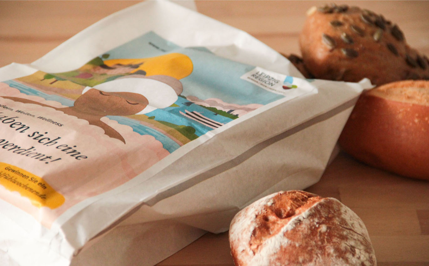 illustrated paper bags for bakery chains in North Rhine-Westphalia promote the Leipzig region